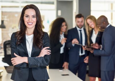 Businesswoman leader in modern office with businesspeople workin